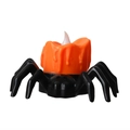 Halloween-LED-Kerze im schwarzen Spinnendesign mit orangefarbenem Tropfwachseffekt - Spinne-Stil