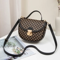 Brown saddle bag with floral patterns, gold lock, black handle, and crossbody strap - Print Black