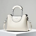 Close-up of white lychee textured leather tote with metal handle and chain detail - Off White