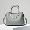 Chic grey lychee texture handbag with silver metal circular handles and crossbody strap - Gray