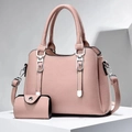 Pink lychee texture tote and coin purse set with silver handles on a white platform - Pink