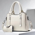 Detail of cream white leather tote bag set with pebble texture and silver metal hardware - Off White