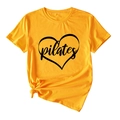 Close-up of heart Pilates print on yellow cotton t-shirt with stylish front knot detail - Mustard Yellow (Black Text)