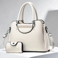 Detail of lychee textured leather tote with silver hardware and matching small pouch - Off White