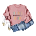 Close-up of pink crewneck sweatshirt with Drink Coffee Read Books print and blue jeans - S / Rose Gold (Black Letters)