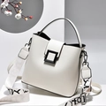 White lychee leather bucket handbag with broad printed strap and black matte square buckle - White