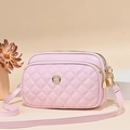 Detail view of pink quilted crossbody bag with triple zippers and golden hardware - Pink