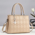 Minimalist beige quilted crossbody bag with dual handles and star charm detail - Apricot