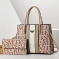 Detail view of the beige patchwork tote bag set with monogram print and metal triangle trim - Khaki