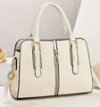 Creamy white crossbody handbag with quilted lattice pattern and golden hardware - Off White