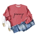 Flat lay of a red gammy sweatshirt styled with blue jeans and white sneakers - Red (Black Font)