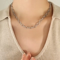 Silver curb link chain necklace with textured oval links worn by a model in a minimal style - 40+5cm / Steel Color Necklace (P995)