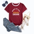 Flat lay of maroon ringer t-shirt with sunshine graphic and stylish casual accessories - S / Burgundy