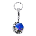 Close-up of a rotating metal keychain featuring a night view of the Eiffel Tower - Blue Brilliant Night (JY007580-17)