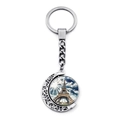 Close-up of a silver moon keychain featuring a rotating Eiffel Tower glass cabochon pendant - Clear Sky Eiffel Tower (JY007580-15)