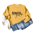 Flat lay of yellow crewneck sweatshirt with 'just a small town girl' print and jeans - Yellow (Black Font)