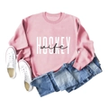 Pink crewneck hockey wife sweatshirt with blue jeans and white canvas shoes flat lay - S / Pink