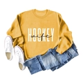 Flat lay of mustard yellow Hockey Wife sweatshirt with blue jeans and canvas shoes - S / Yellow