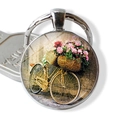 Vintage bicycle flower basket keychain with a round glass cabochon in a silver setting - Retro Illustration Bicycle and Flowers (JY007506-13)