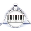 Detail of the piano key pattern inside the circular glass cabochon heart necklace - Classic Glass Patch Piano Keys Style (JY007513-12)
