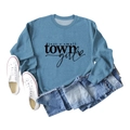 Flat lay of foggy blue crewneck sweatshirt with just a small town girl print and denim shorts - Blue (Black Font)