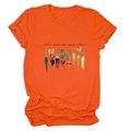 Detail of orange cotton T-shirt with Let's Root For Each Other vegetable graphic print - S / Tops / Orange (Black Text)
