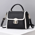 Bolso bandolera de cuero negro con ribete blanco y cierre giratorio metálico dorado - Negro