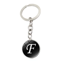 Porte-clés lettre F avec anneau argenté et pendentif rond en verre sur fond blanc - Lettre F