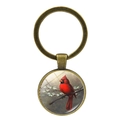 Vintage bronze keychain featuring a red cardinal bird illustration with glass dome finish - Cardinal Art Illustration Style (XSWX4976-10)