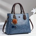 Retro blue lychee pattern faux leather handbag with brown straps and plush pendant charm - Blue