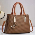Caramel tote bag with dark brown cross print, featuring gold hardware and bow charm detail - L30cm x H23cm x W13cm / Earthy Yellow