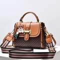 Brown leather handbag with monogram print, striped shoulder strap and teddy bear charm - L23 H17 W12 / Earthy Yellow