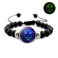 Luminous Leo constellation bracelet with black matte beads and green glow effect detail - Leo
