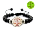 Luminous Libra constellation bracelet with matte black beads and adjustable braided cord - Libra