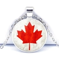 Macro shot of silver round necklace featuring a red maple leaf glass dome pendant - Simple Medallion Style (JY007841-10)