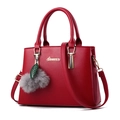 Elegante borsa in pelle rossa con logo Almuver e portachiavi decorativo con foglia - Borgogna