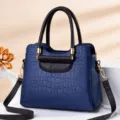 Sac à main bleu foncé gaufré crocodile avec anses marron et bandoulière réglable - Motif Crocodile Bleu Royal