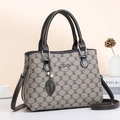 Tote bag with monogram texture and leaf charm set against lifestyle home decor - New Style / Black