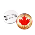 Detail view of Canada flag badge showing the maple leaf design and metal pin back - Yellowed Vintage Maple Style (JY007844-3)