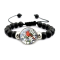Detail of adjustable beaded bracelet featuring black matte beads and red cardinal bird pendant - Cardinal in White Flowers Style (JY007894-9)