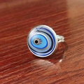 Macro side view of Turkish evil eye ring with blue glass dome and silver band - Traditional Eye Pattern (JY007909-8)