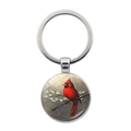 Detail of round silver keychain featuring a red cardinal bird on a branch with flowers - Vintage Cardinal Flower Style (JY007872-10)