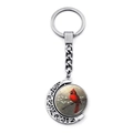 Macro view of rotating silver cardinal bird charm with vintage crescent moon detailing - Cardinal Perched On Branch (JY007878-10)