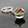 Detailed view of cardinal bird double-sided glass ball keychain with polished silver metal - Red and Green Floral Double Sided Ball Style (JY007882-12)