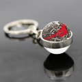Macro detail of cardinal glass ball keychain showing glossy silver metal base and reflection - 3D Hemisphere Cardinal Style (JY007882-11)