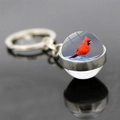 Macro detail of cardinal bird keychain with double-sided glass ball and silver alloy ring - Realistic Cardinal Portrait Style (JY007882-7)