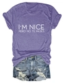 Detailed flat lay of purple I'M NICE printed T-shirt and distressed blue denim shorts - Purple (White Font)