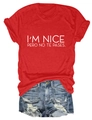 Close-up of red cotton T-shirt with I'M NICE slogan and distressed denim shorts - Red (White Font)