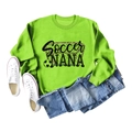 Flat lay of neon green Soccer NANA sweatshirt with denim shorts and white sneakers - S / Fluorescent Green