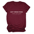 Close-up of burgundy cotton t-shirt with CAN'T THROW STONES white text and folded sleeves - Wine Red (White Font)